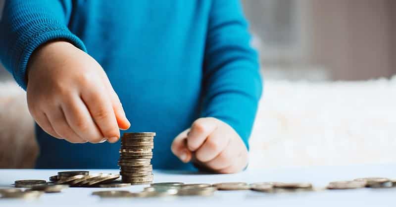 Child playing with coins