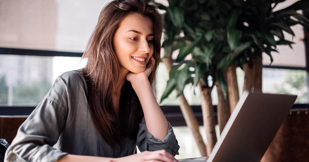 Woman typing on laptop